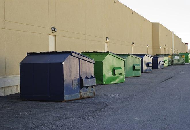 a crowd of dumpsters of all colors and sizes at a construction site in Staunton